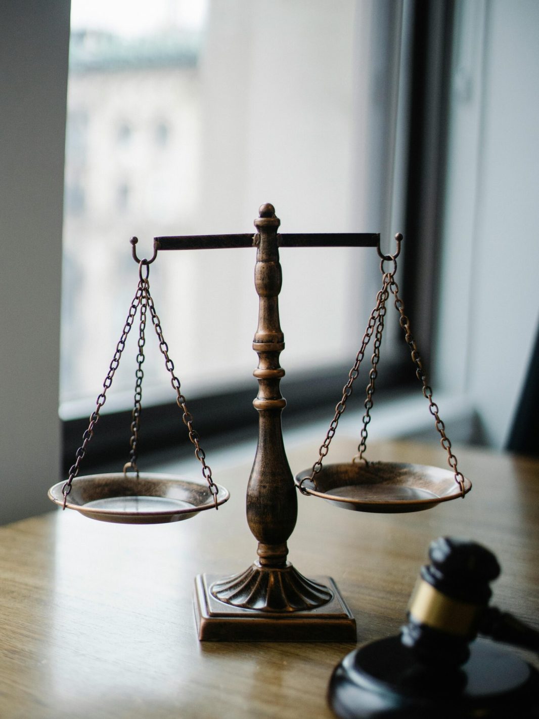 pexels photo 5669602 5669602 Decorative judgement scale and gavel placed on desk in light lawyer office against window
